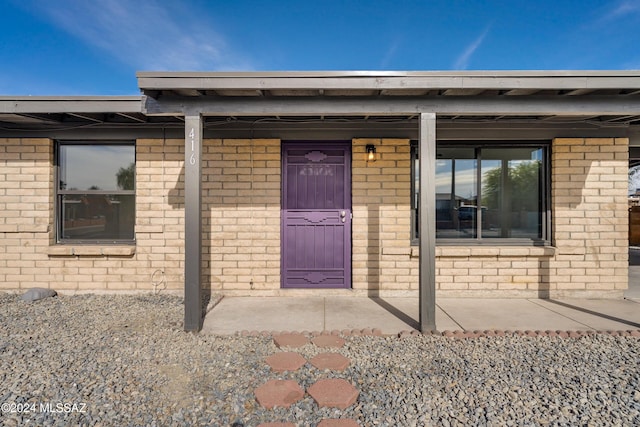 doorway to property with a porch