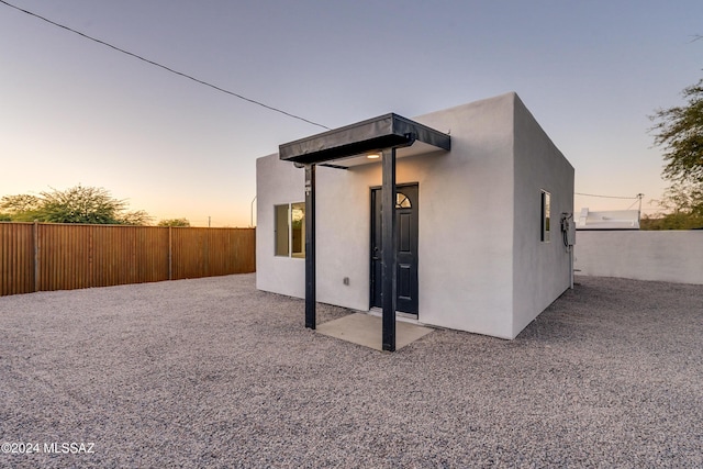 view of property exterior at dusk