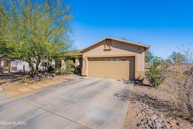 ranch-style home featuring a garage