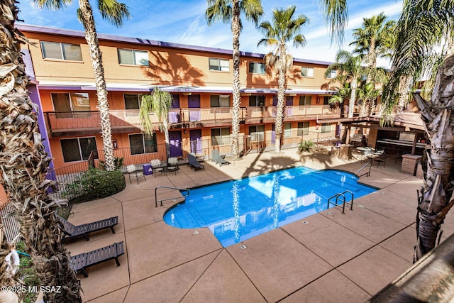 view of swimming pool featuring a patio