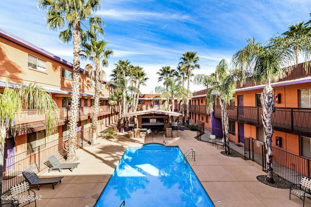 view of swimming pool with a patio