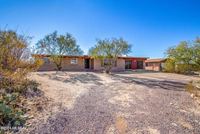 ranch-style house with a carport