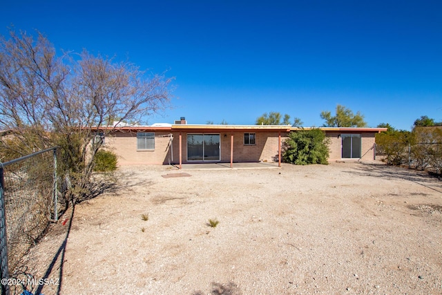 rear view of house with a patio