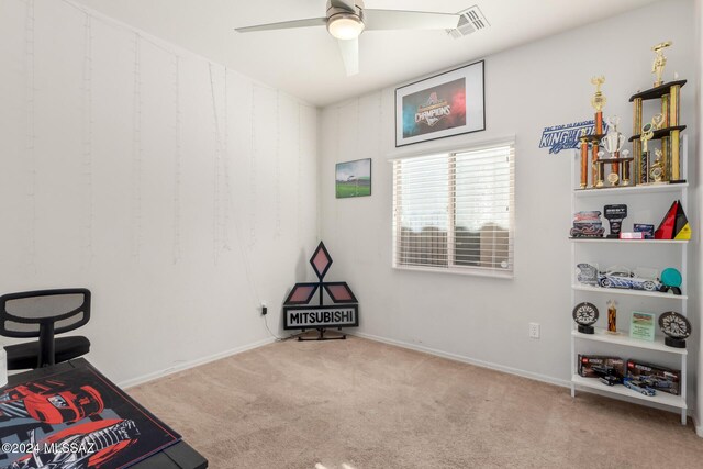 bedroom with ceiling fan and light carpet