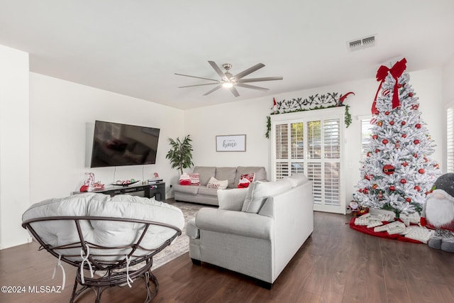 living room featuring ceiling fan and wood-type flooring