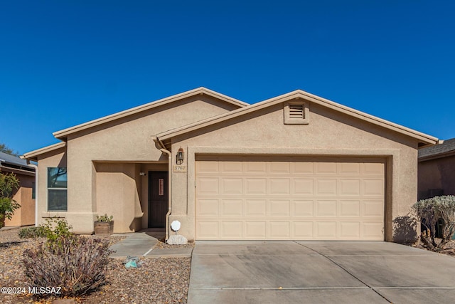 ranch-style home with a garage