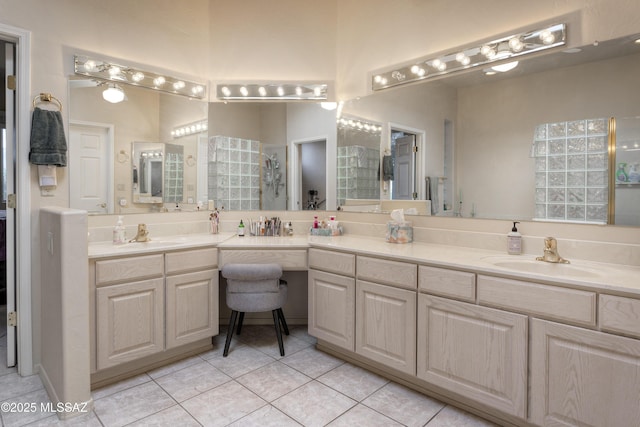 bathroom featuring tile patterned flooring and vanity