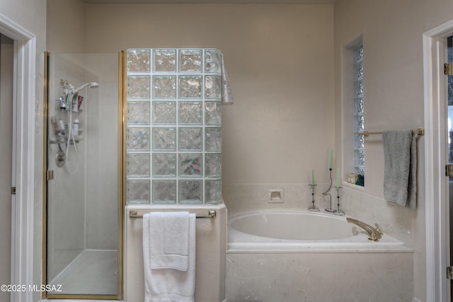 bathroom with separate shower and tub