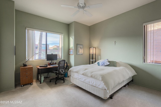 bedroom with ceiling fan and carpet floors