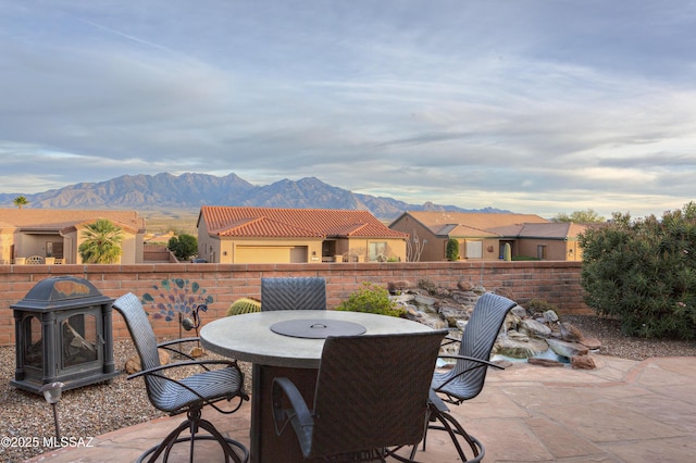 view of patio / terrace with a mountain view