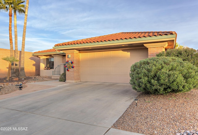 mediterranean / spanish home featuring a garage