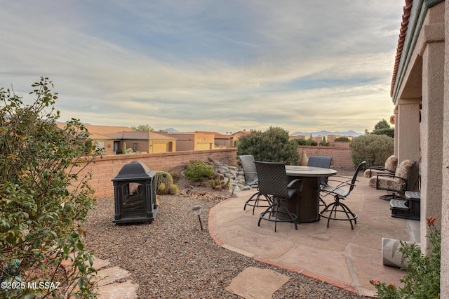 view of patio terrace at dusk