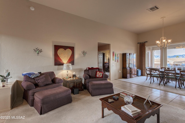 living room with light tile patterned floors and a chandelier