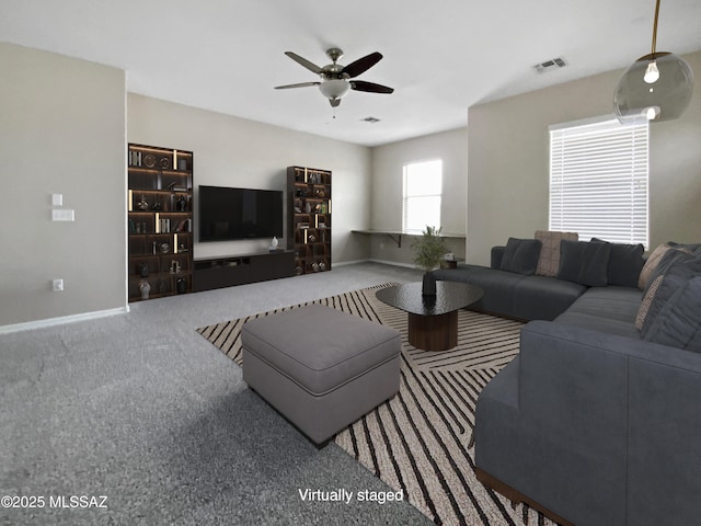 living room with ceiling fan and carpet flooring