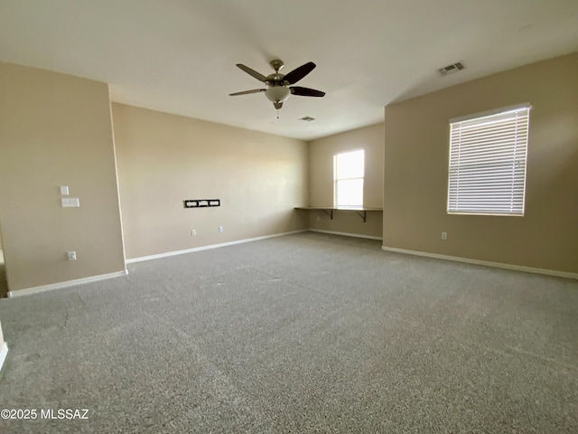 carpeted empty room with ceiling fan