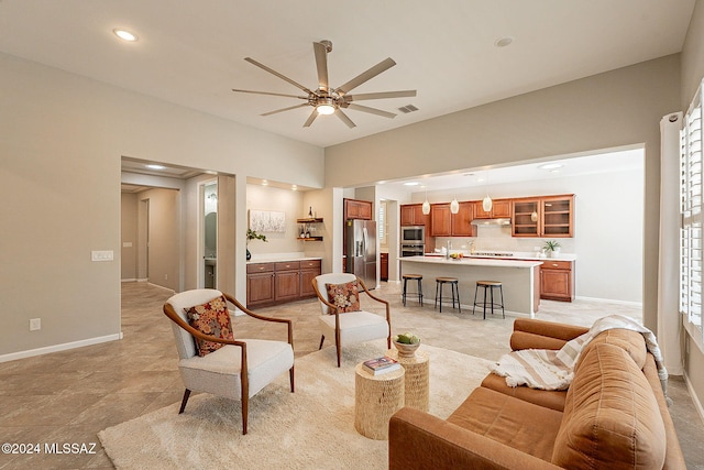 living room with plenty of natural light and ceiling fan