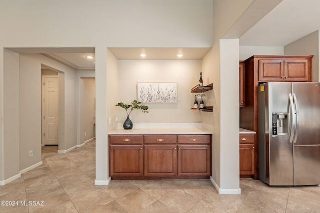 kitchen with stainless steel fridge with ice dispenser