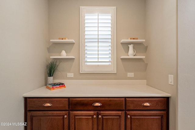 kitchen featuring dark brown cabinetry