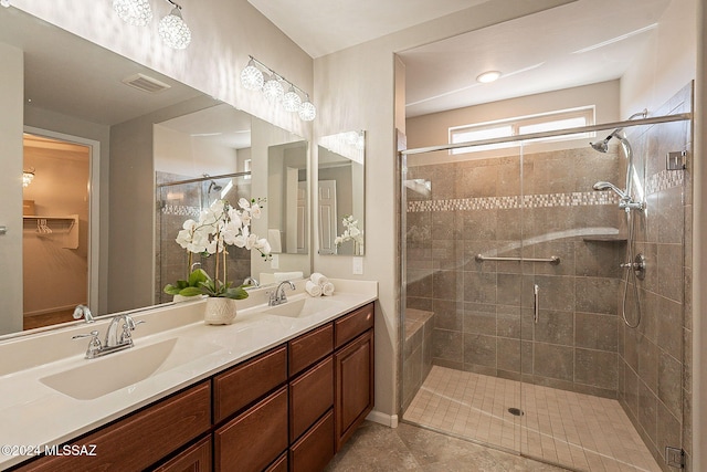 bathroom featuring vanity and a shower with shower door