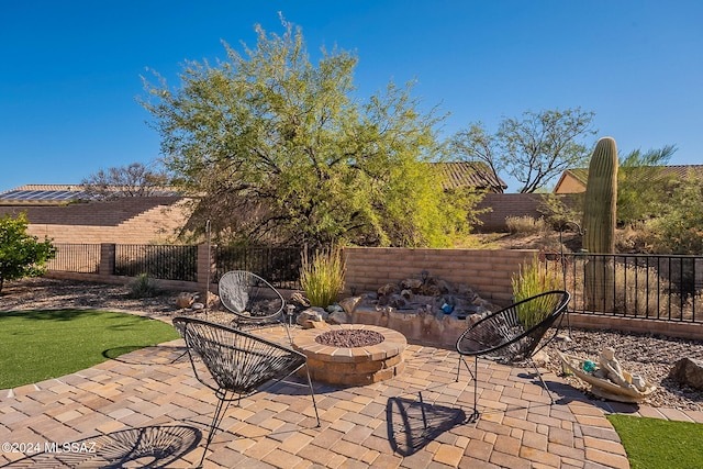 view of patio featuring an outdoor fire pit