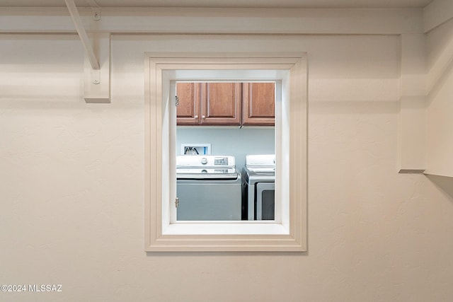 room details featuring washer and clothes dryer