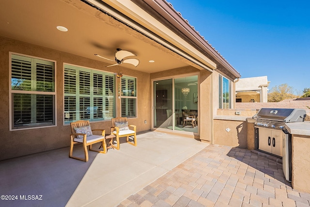 view of patio / terrace with ceiling fan and area for grilling