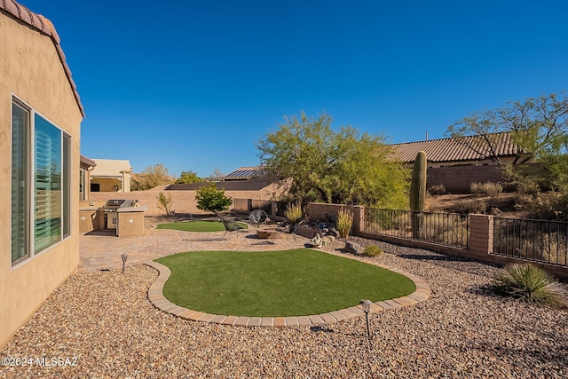 view of yard with an outdoor fire pit and a patio area