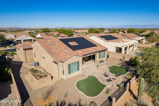 birds eye view of property featuring a mountain view