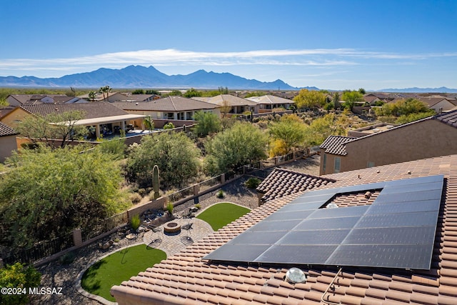 birds eye view of property with a mountain view