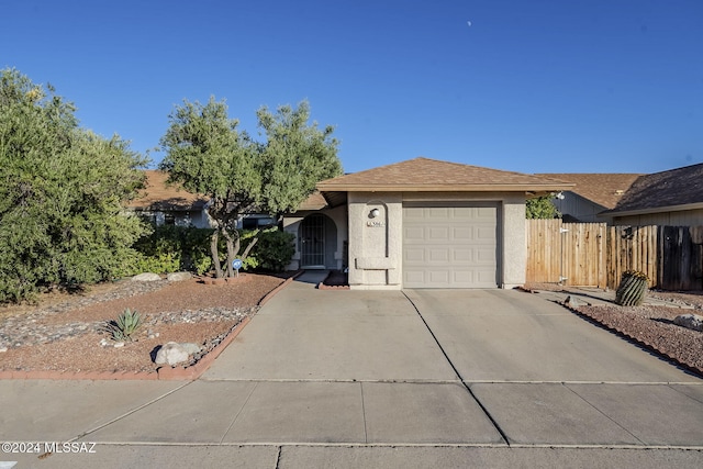 single story home featuring a garage