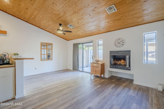 unfurnished living room featuring wood-type flooring, ceiling fan, lofted ceiling, and wood ceiling