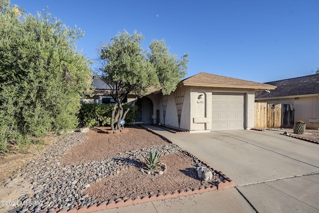 ranch-style house featuring a garage