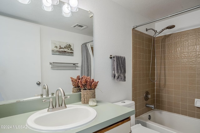 full bathroom with shower / bath combination with curtain, vanity, and toilet