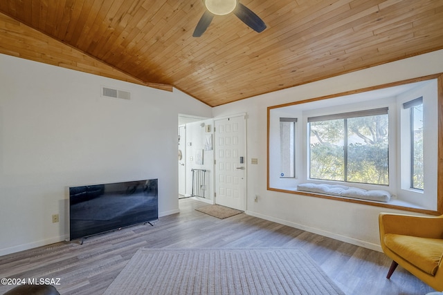 unfurnished room featuring light hardwood / wood-style flooring, vaulted ceiling, ceiling fan, and wood ceiling