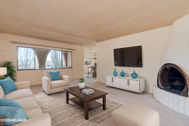 living area featuring a textured ceiling and light carpet