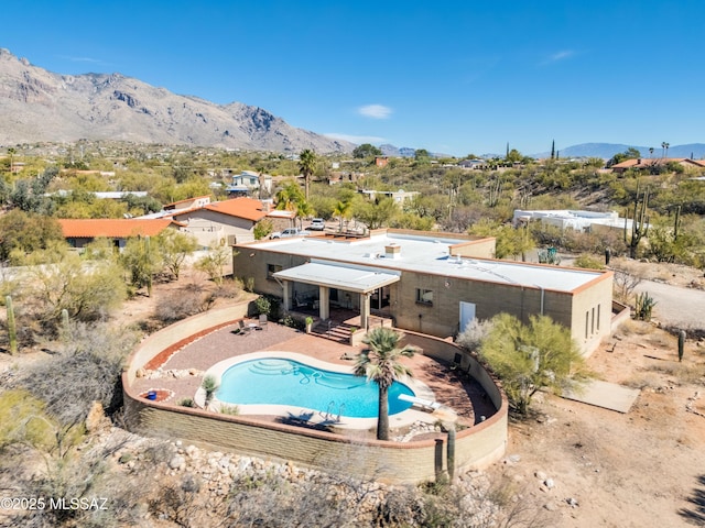 back of house with a patio area and a mountain view