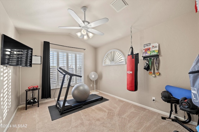 workout area featuring ceiling fan, light carpet, and lofted ceiling