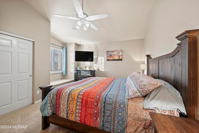 carpeted bedroom featuring ceiling fan and lofted ceiling