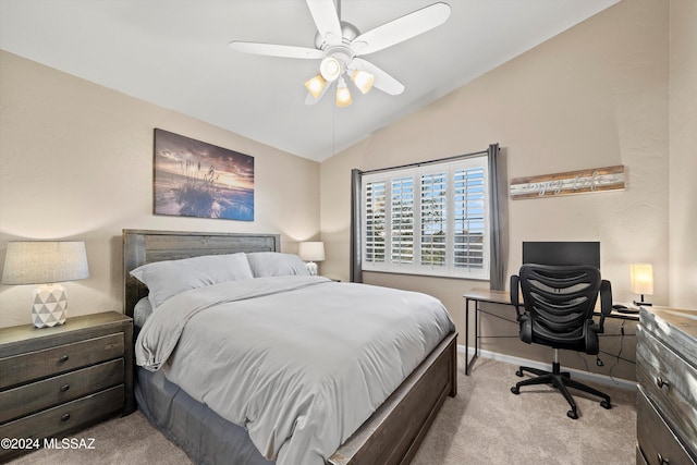 bedroom featuring ceiling fan, light carpet, and vaulted ceiling