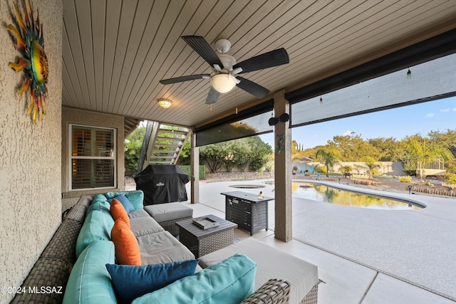 view of patio featuring outdoor lounge area, area for grilling, and ceiling fan