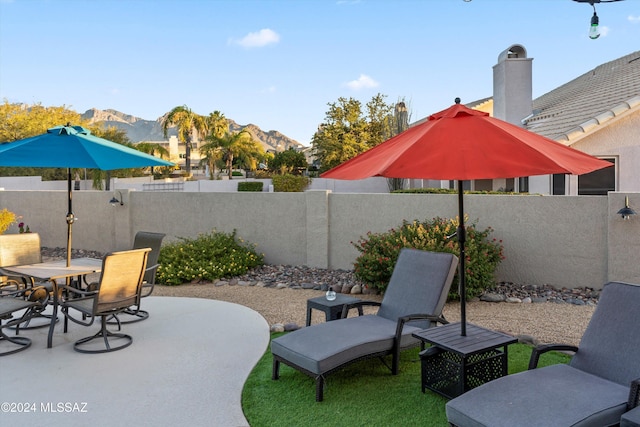 view of patio / terrace featuring a mountain view