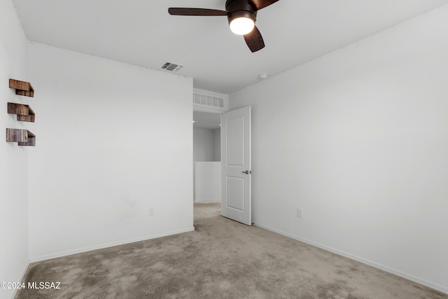 unfurnished bedroom featuring ceiling fan and light carpet