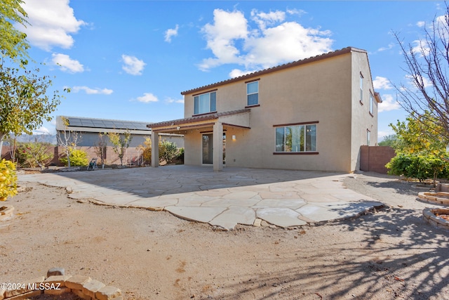 rear view of house with a patio