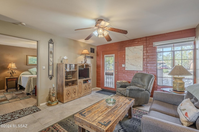 living room featuring plenty of natural light and ceiling fan