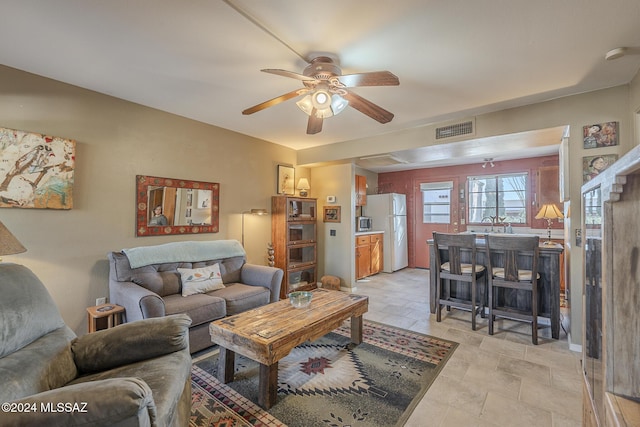 living room featuring ceiling fan