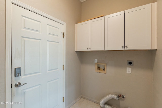 laundry room with washer hookup, light tile patterned floors, cabinets, and hookup for an electric dryer