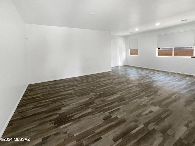 empty room featuring dark hardwood / wood-style flooring