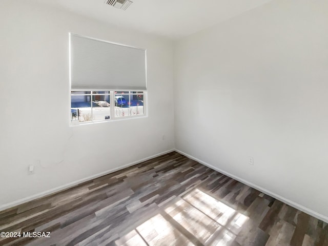 empty room featuring dark hardwood / wood-style floors