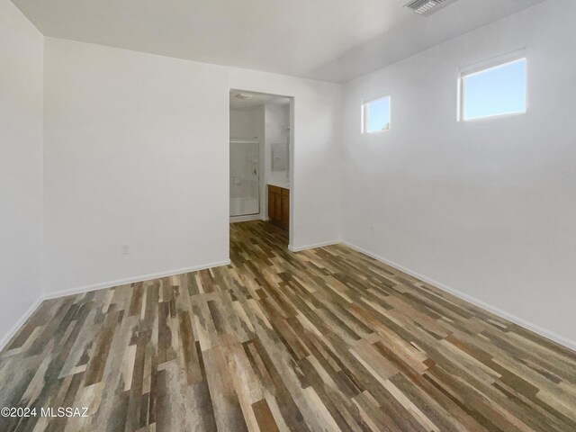 unfurnished room featuring dark hardwood / wood-style floors