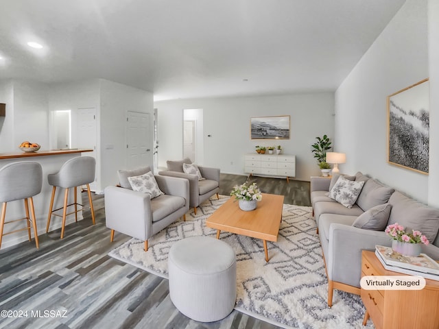 living room with dark hardwood / wood-style flooring